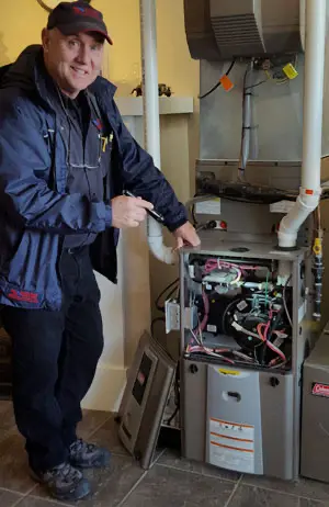 Technician Repairing Furnace