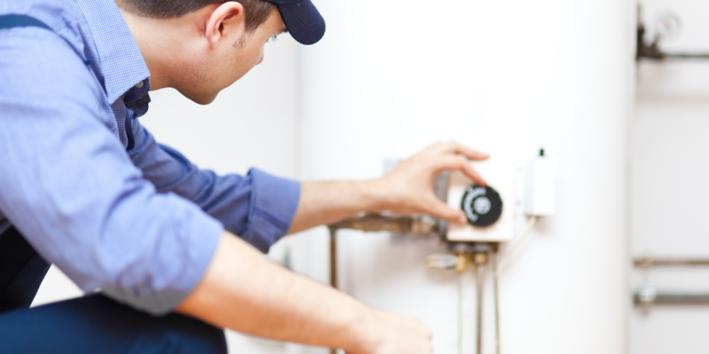 Technician Working On Hot Water Tank