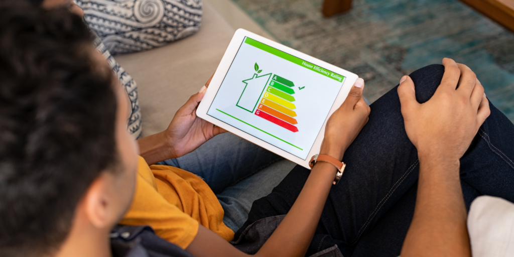 Family Looking At Home Energy Savings Chart - The Hidden Benefits of HRV Systems for Your Home & More
